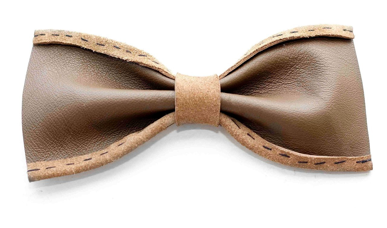 Brown leather bow tie on a white background